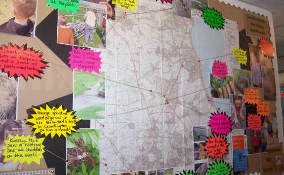 a map, annotated with images and quotations based highlighting the successes of the programme 